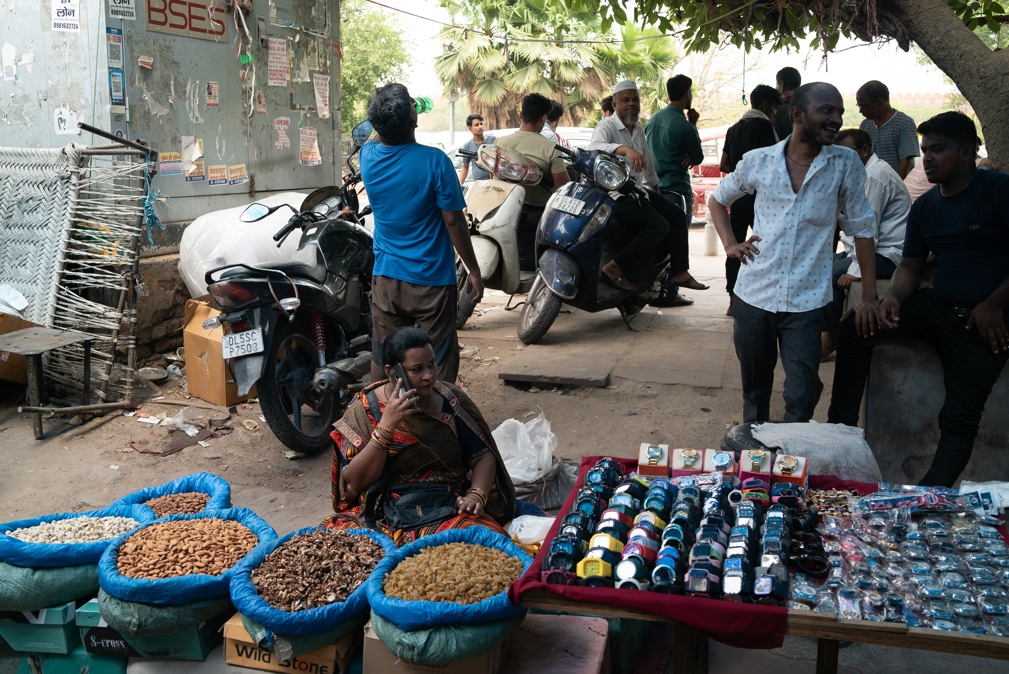 Jyoti Ubreja, 36, sells dry fruits on a concrete pavement that radiates heat as temperatures reach 46 degrees Celsius near the Red Fort in New Delhi, India, June 2024. (Photo credit: Bhumika Saraswati)