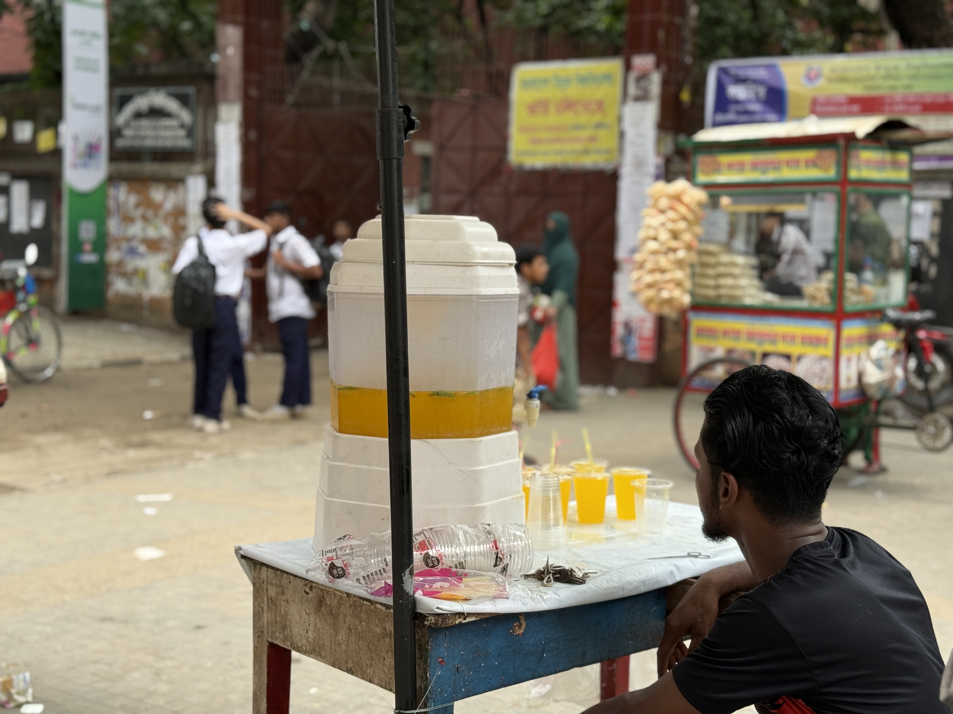 A street vendor sells juice on a hot day outside a school in Dhaka, Bangladesh, May 29, 2025.Mosabber Hossain/Climate Resilience for All