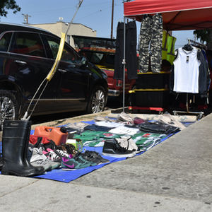 Clothing and shoes sit exposed to the sun in the Historic South Central neighborhood of Los Angeles, California, on September 14, 2025. Heat makes the soles separate from shoes and clothing gets sun-bleached and brittle, vendors say. Climate Resilience for All/Rachel Parsons
